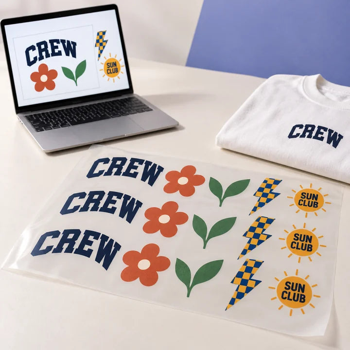 Mockup: printed DTF gang sheet with a laptop showing the designs being arranged and a T-shirt example