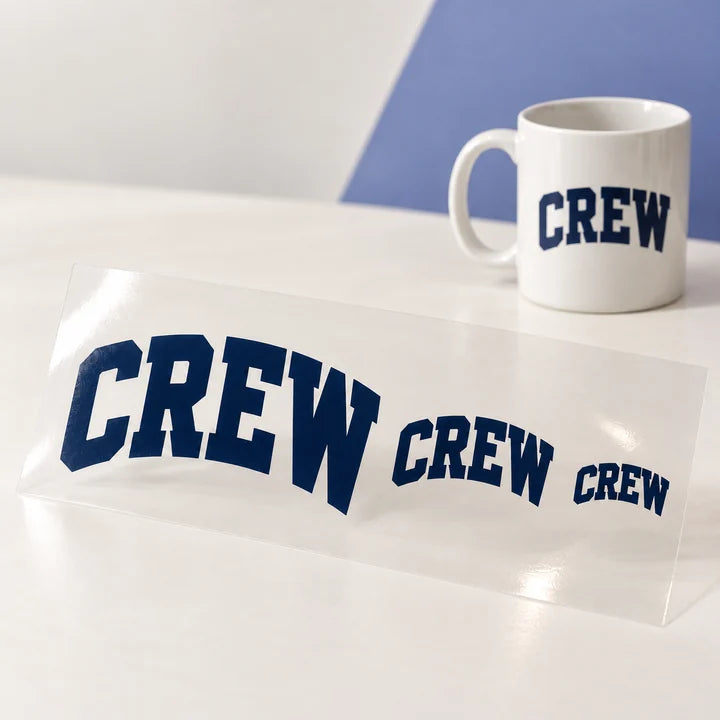 Mockup: one UV-DTF design in three sizes on clear film, with a smaller mug application example